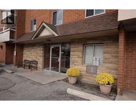 A building with a sign that says RE/MAX Aboutowne Realty Corp Brokerage.