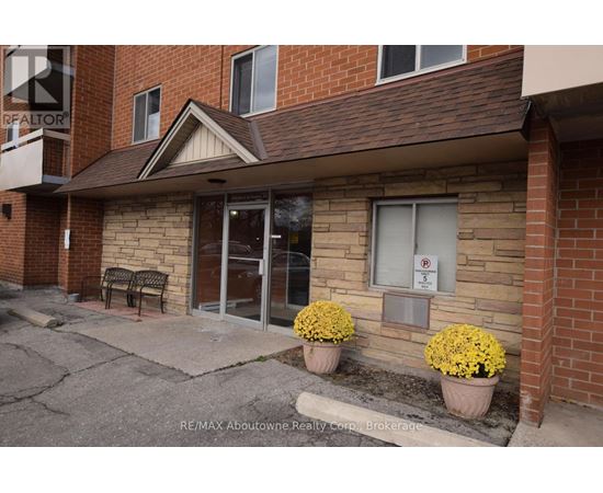 A building with a sign that says RE/MAX Aboutowne Realty Corp Brokerage.