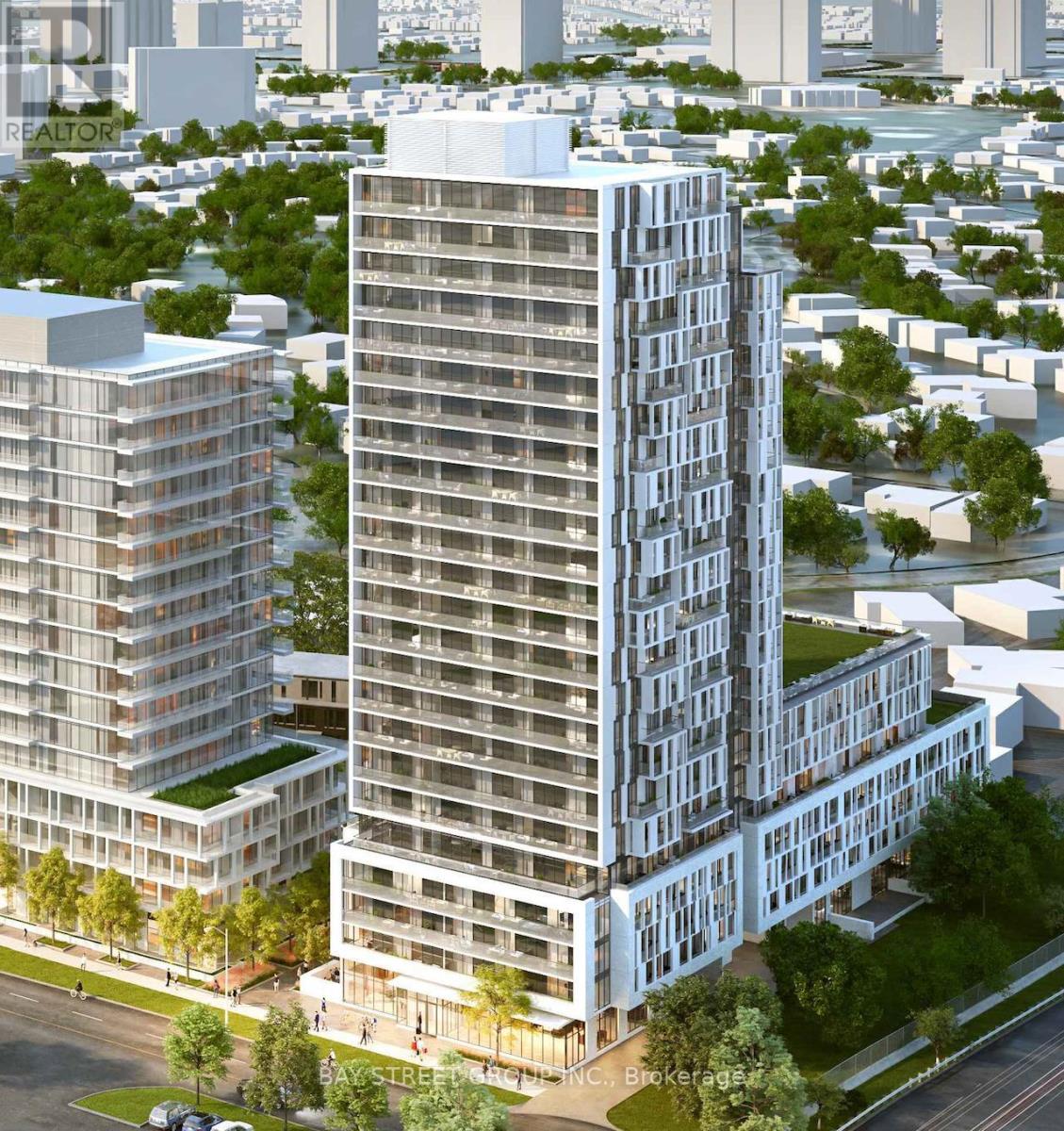 A modern high-rise building with balconies is surrounded by other buildings and greenery.