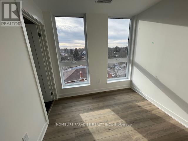 A room with a view of a snowy landscape outside the window.