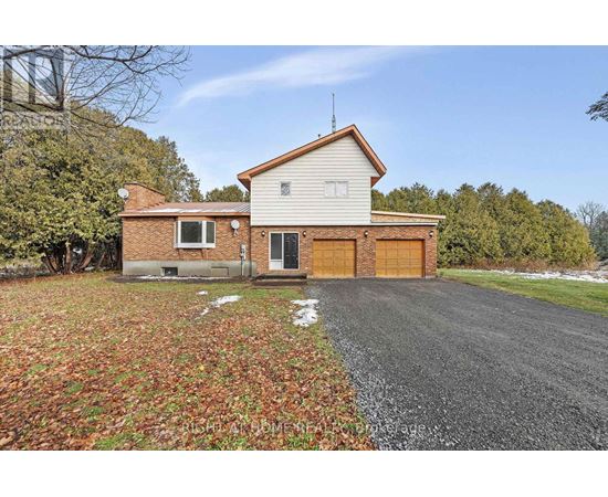A house with a driveway and a garage door.