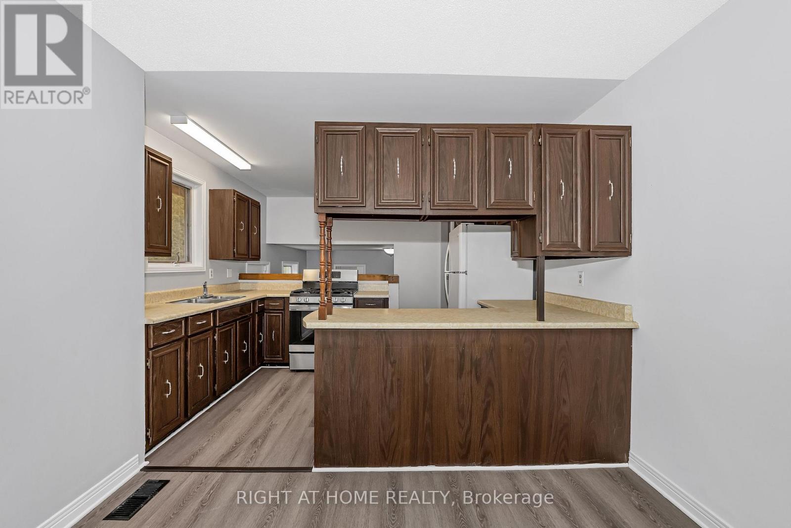A kitchen with wooden cabinets and a countertop.