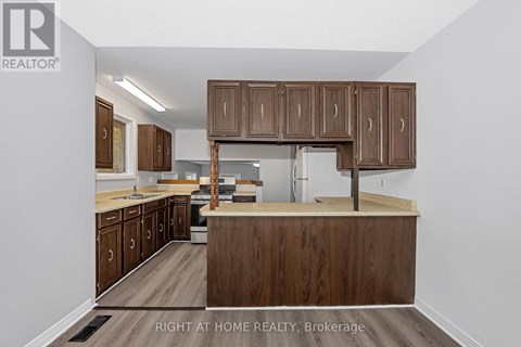 A kitchen with wooden cabinets and a countertop.