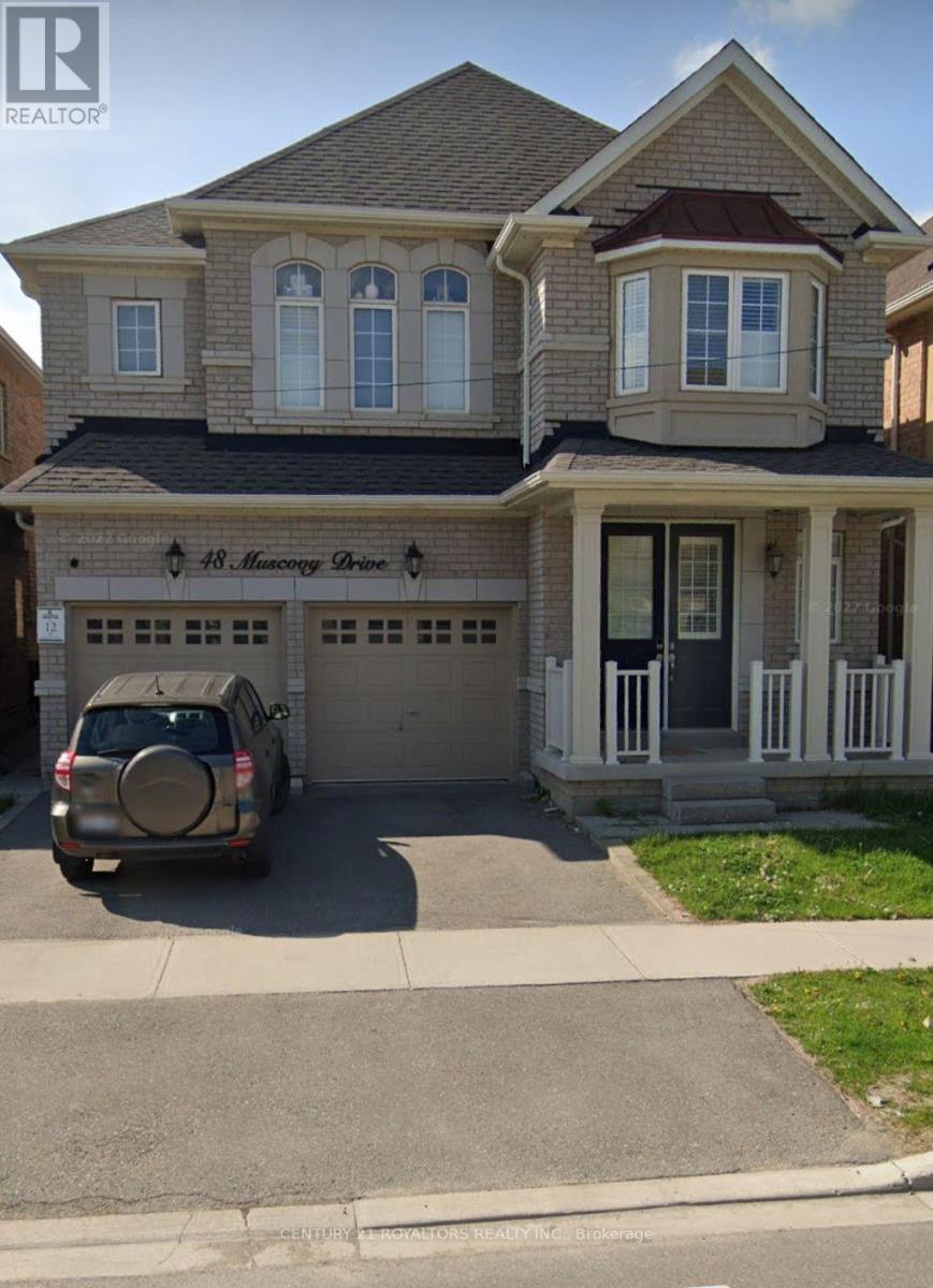 A house with a car parked in front of it.