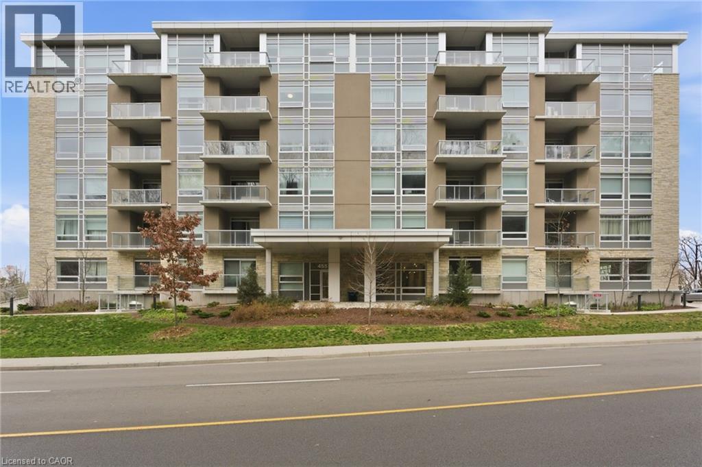 A large apartment building with a balcony on each floor.