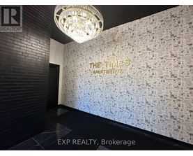 A wall covered in newspaper print with the words "The Times Apartments" written on it.