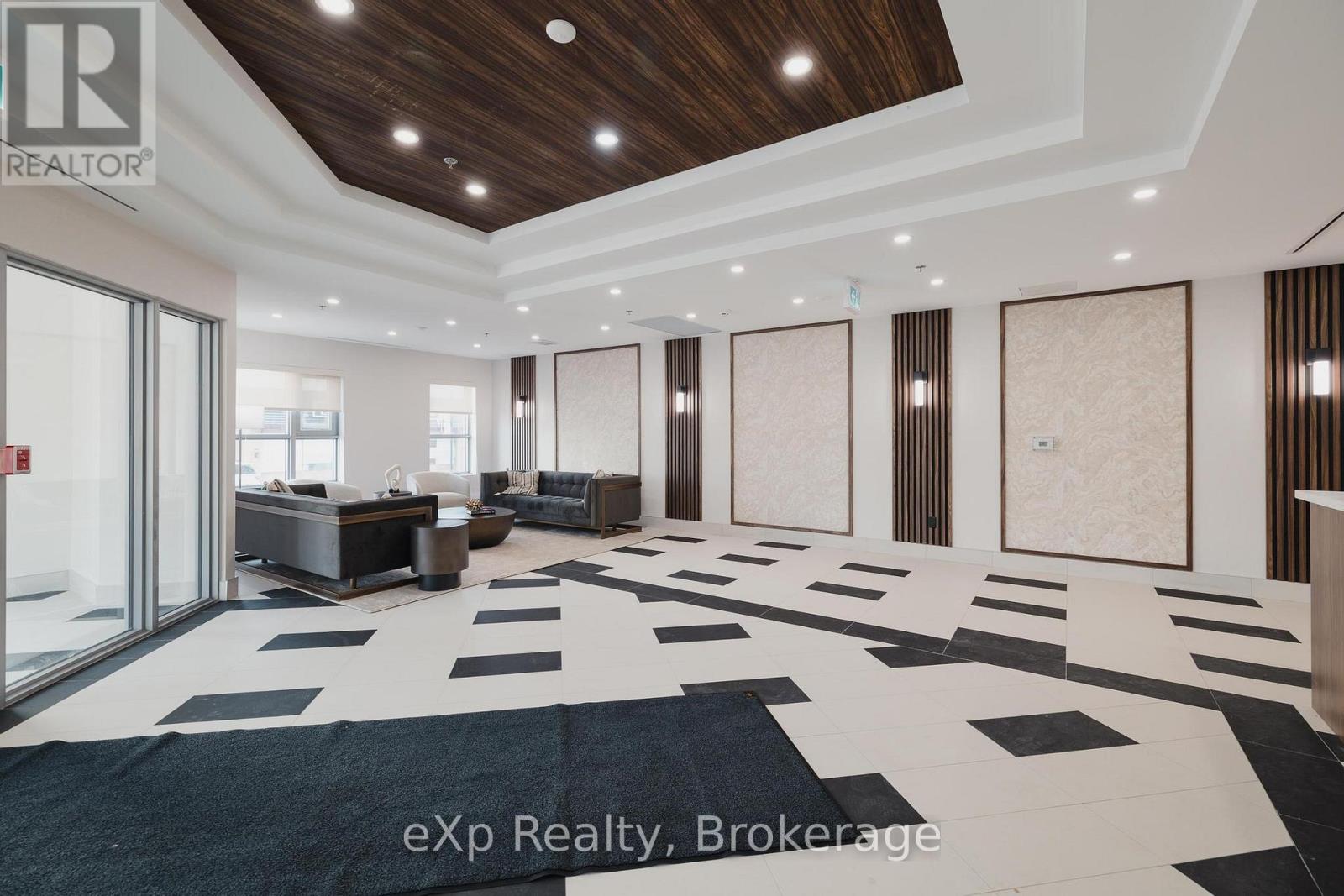 A spacious room with a black and white checkered floor and wooden ceiling.
