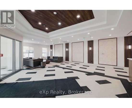 A spacious room with a black and white checkered floor and wooden ceiling.