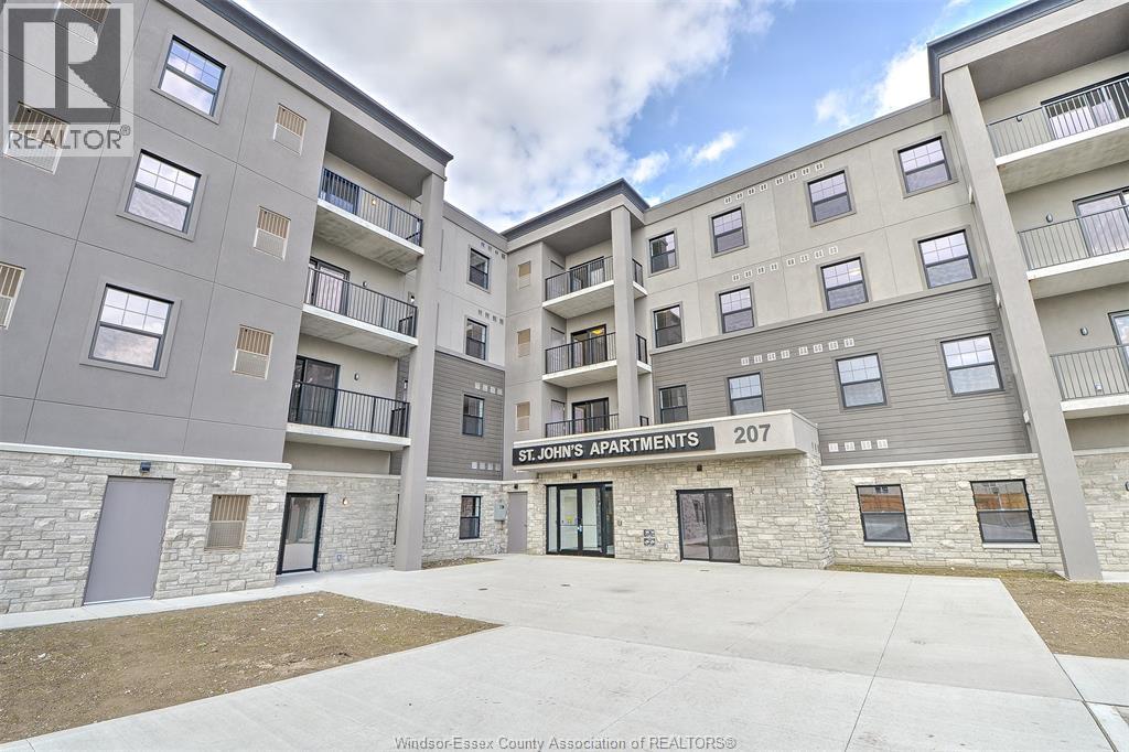 The image shows a multi-story residential building with the name "St. John's Apartments" on the front.