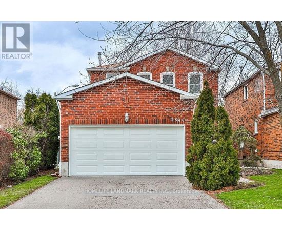 A red brick house with a white garage door.