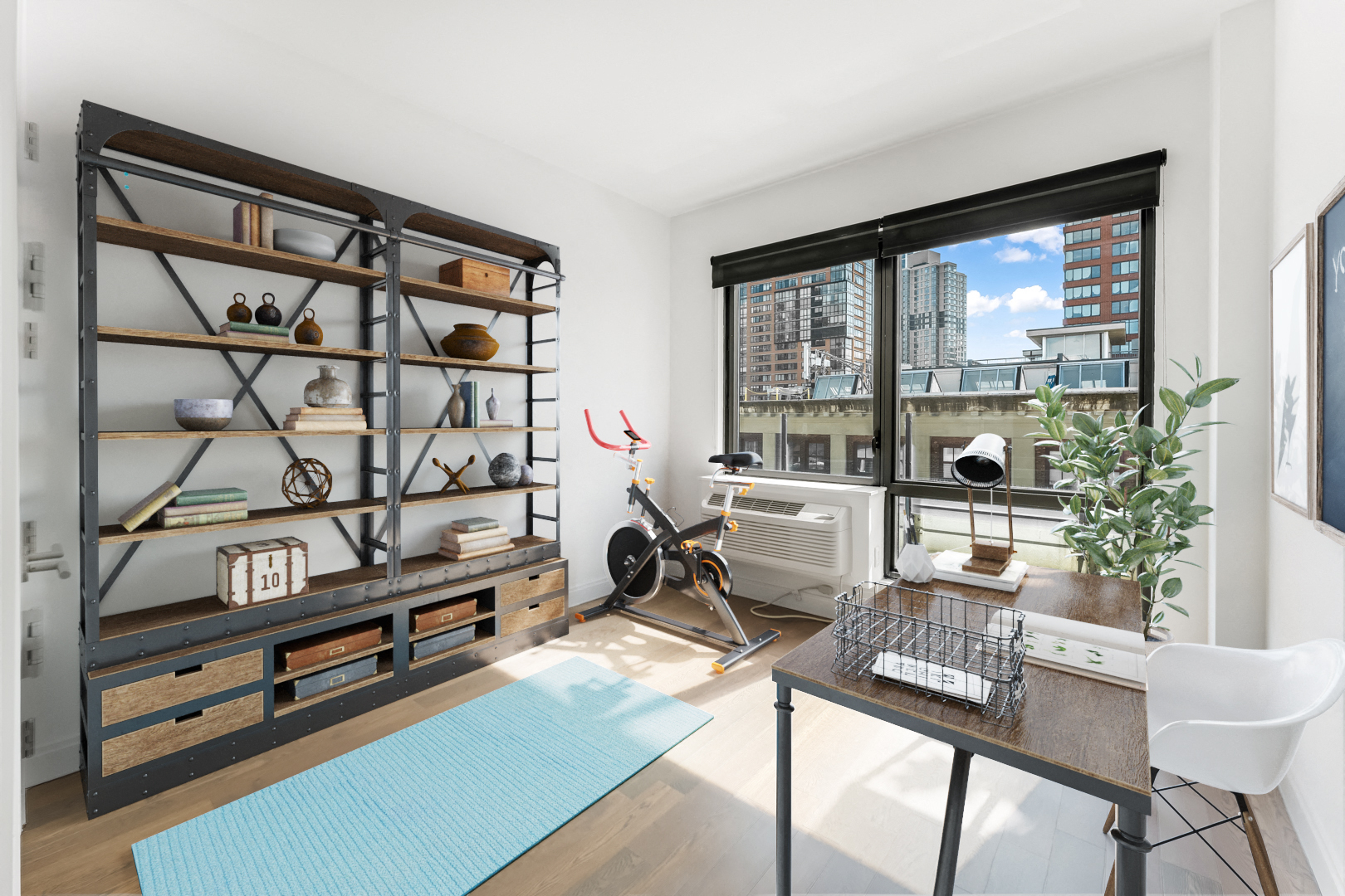 a living room with a large window and a desk with a bike in it