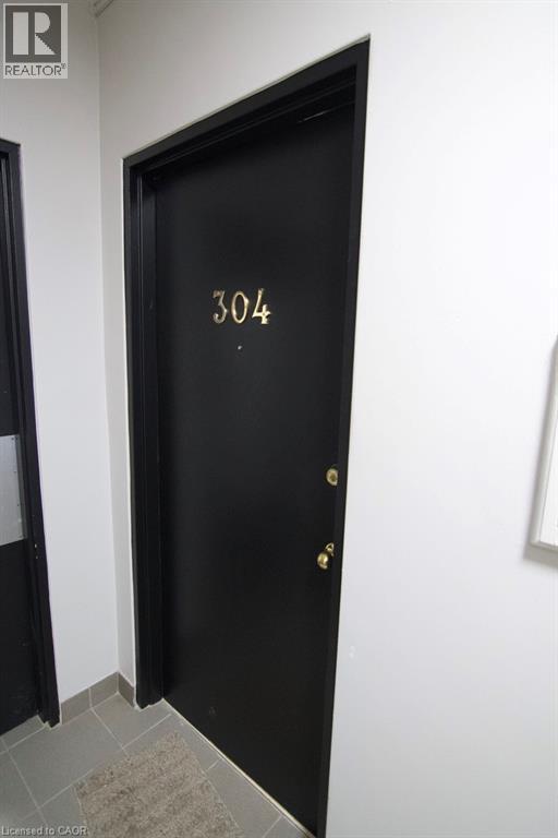 A black door with the number 304 on it.