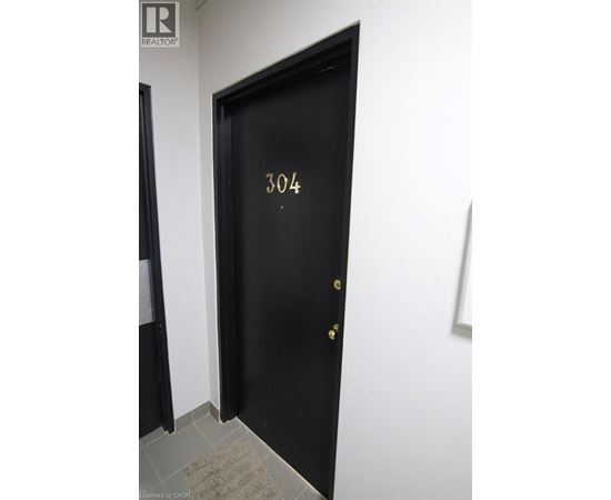 A black door with the number 304 on it.