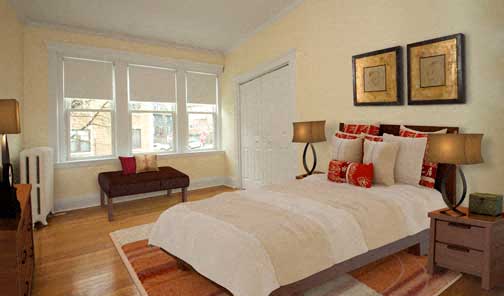 a bedroom with a bed and two windows