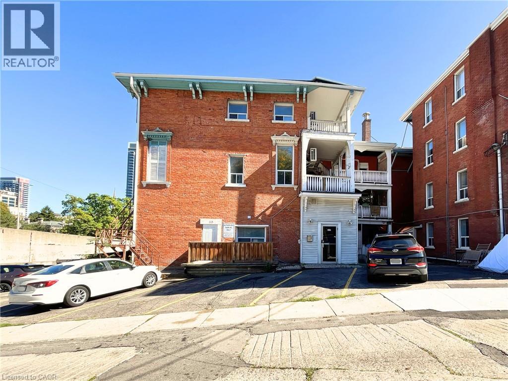 A building with a car parked in front of it.