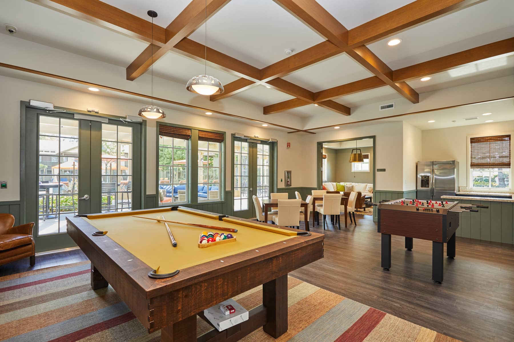 a game room with a pool table and a billiards
