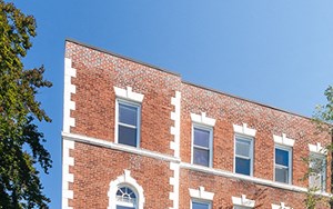 Charles Chauncy a red brick apartment building on a city street