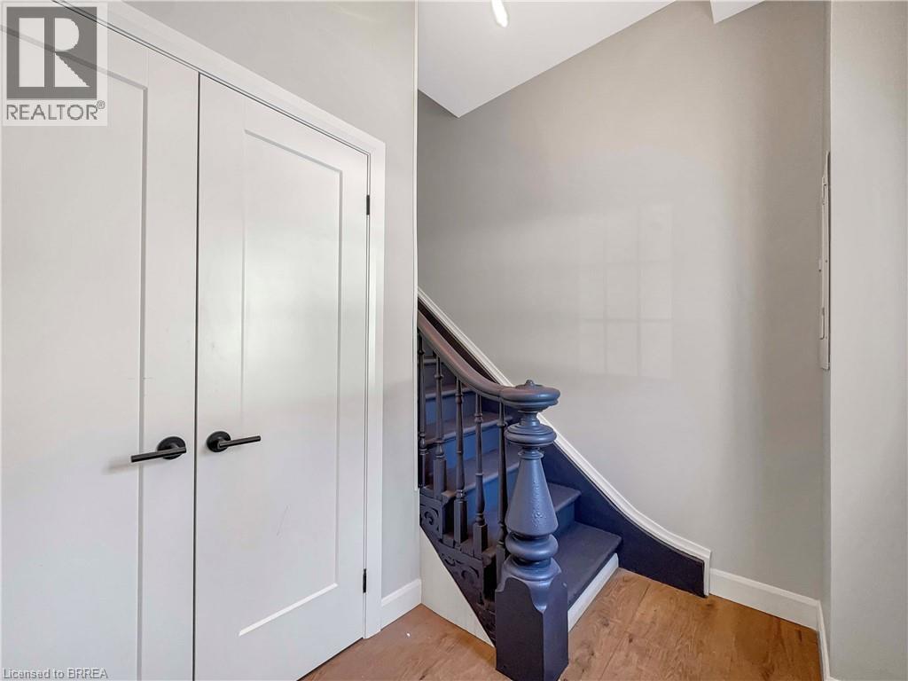 A white door with a black handle is on the left side of the image.