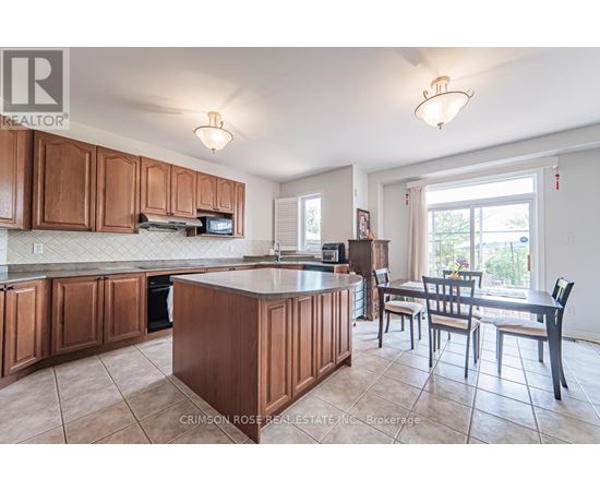 A kitchen with brown cabinets and a white countertop.