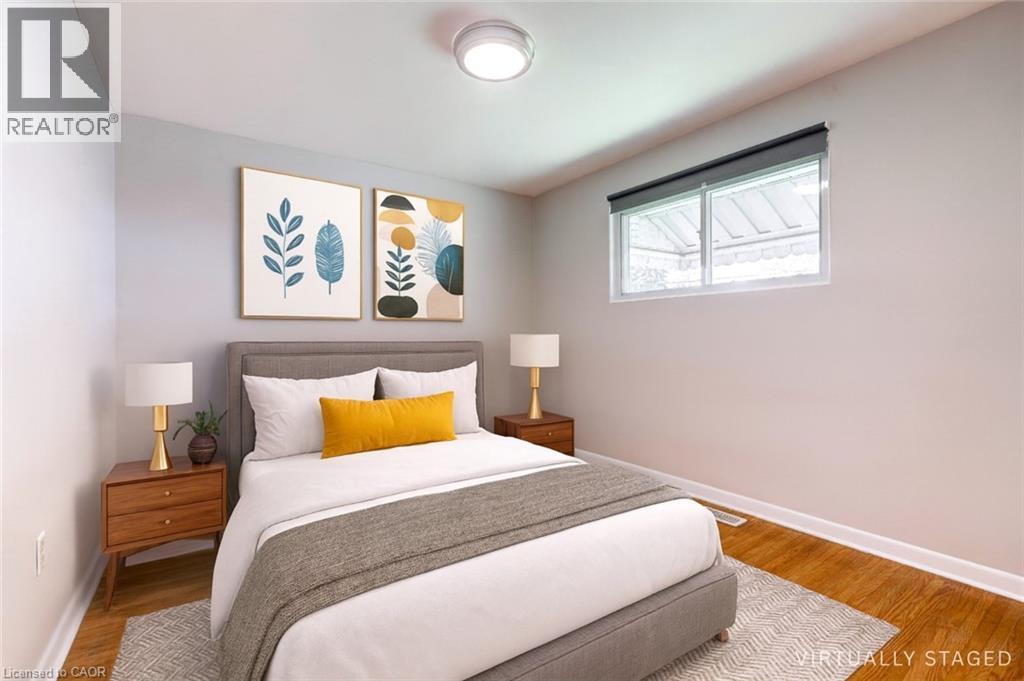 A bedroom with a bed, two nightstands, and a painting on the wall.