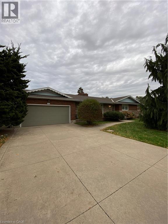 A house with a driveway in front of it.