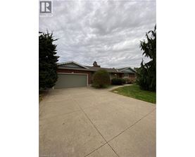 A house with a driveway in front of it.