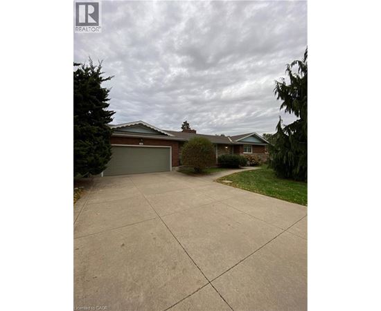 A house with a driveway in front of it.