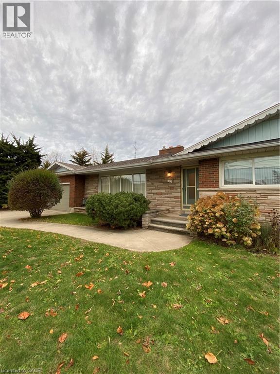 A house with a lawn in front of it.