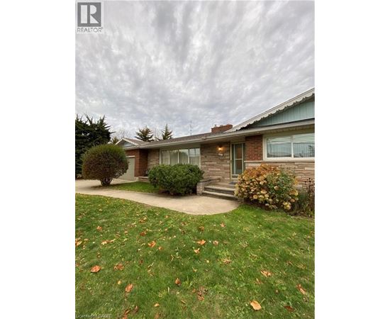 A house with a lawn in front of it.