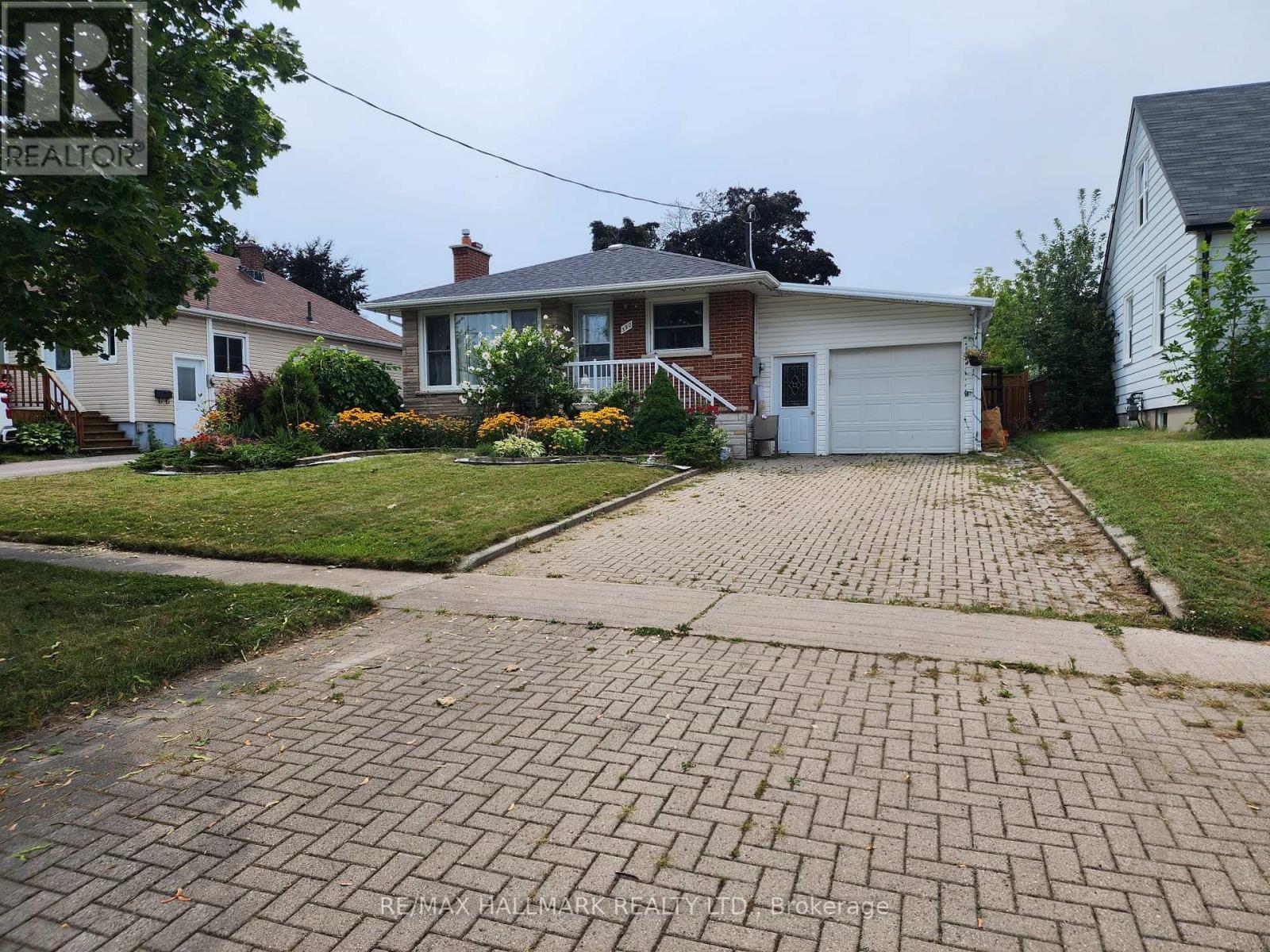 A house with a driveway in front of it.
