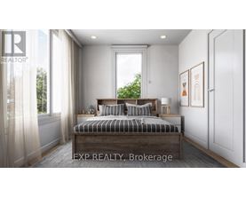 A bedroom with a large bed and a window with curtains.