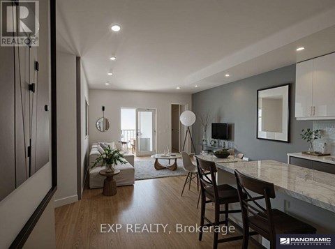 A modern kitchen with a dining table and chairs.