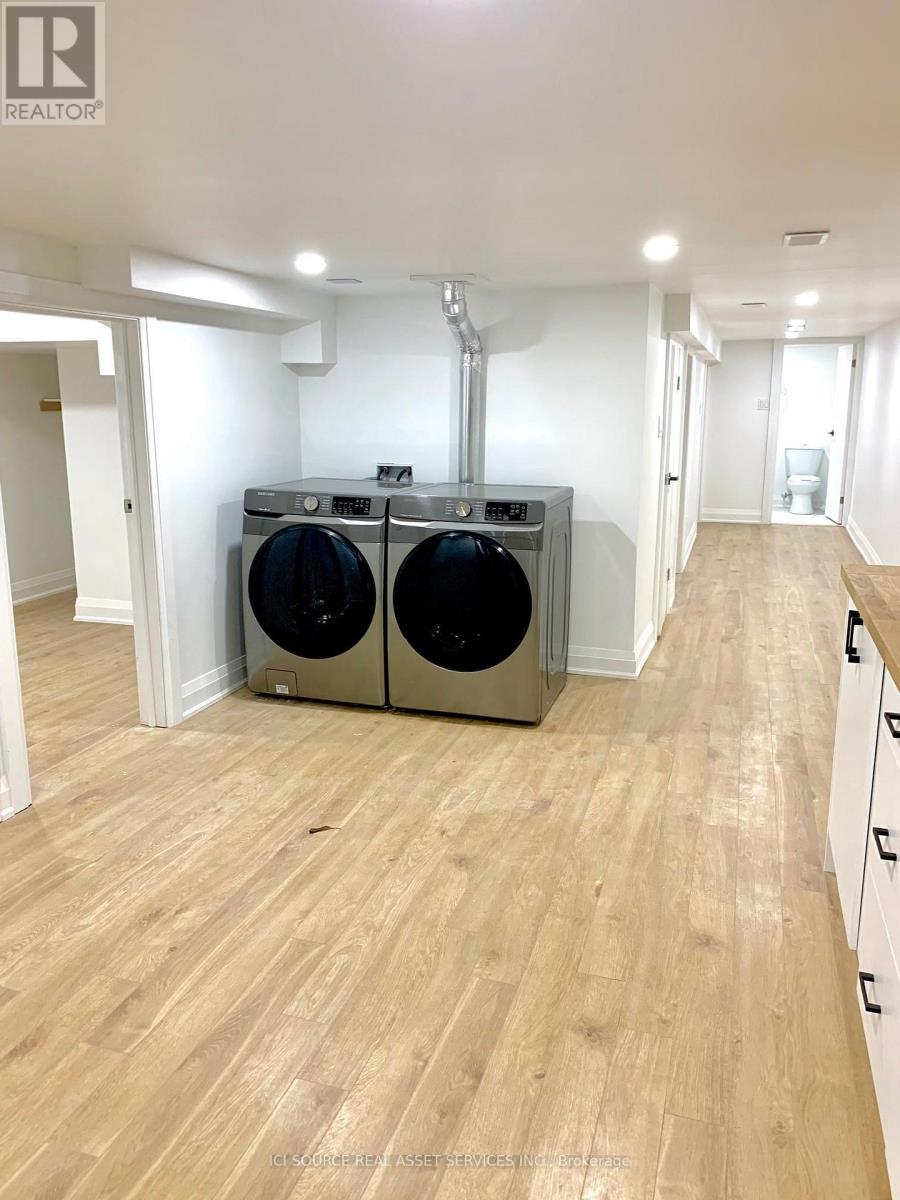 A realtor's photo of a laundry room with a washer and dryer.