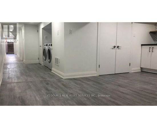 A laundry room with a washer and dryer in it.