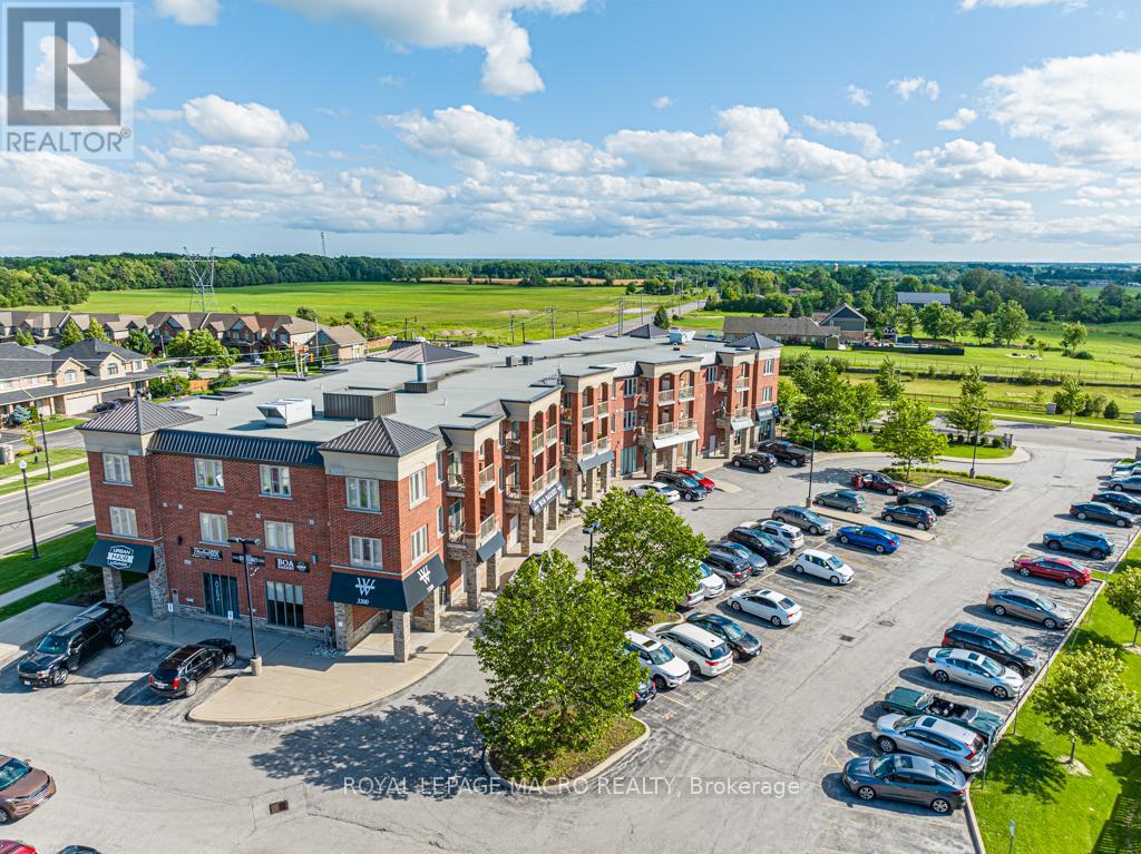 A large building with a parking lot in front of it.