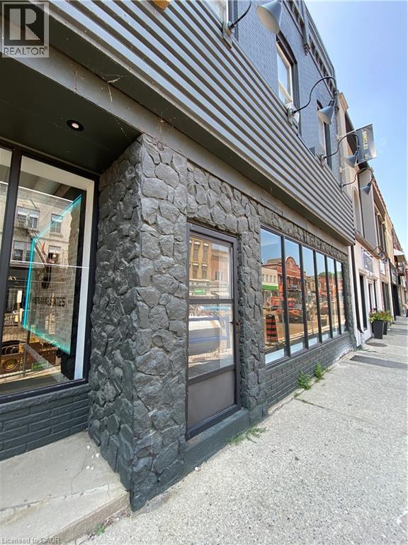 A building with a stone pillar in front of a window.