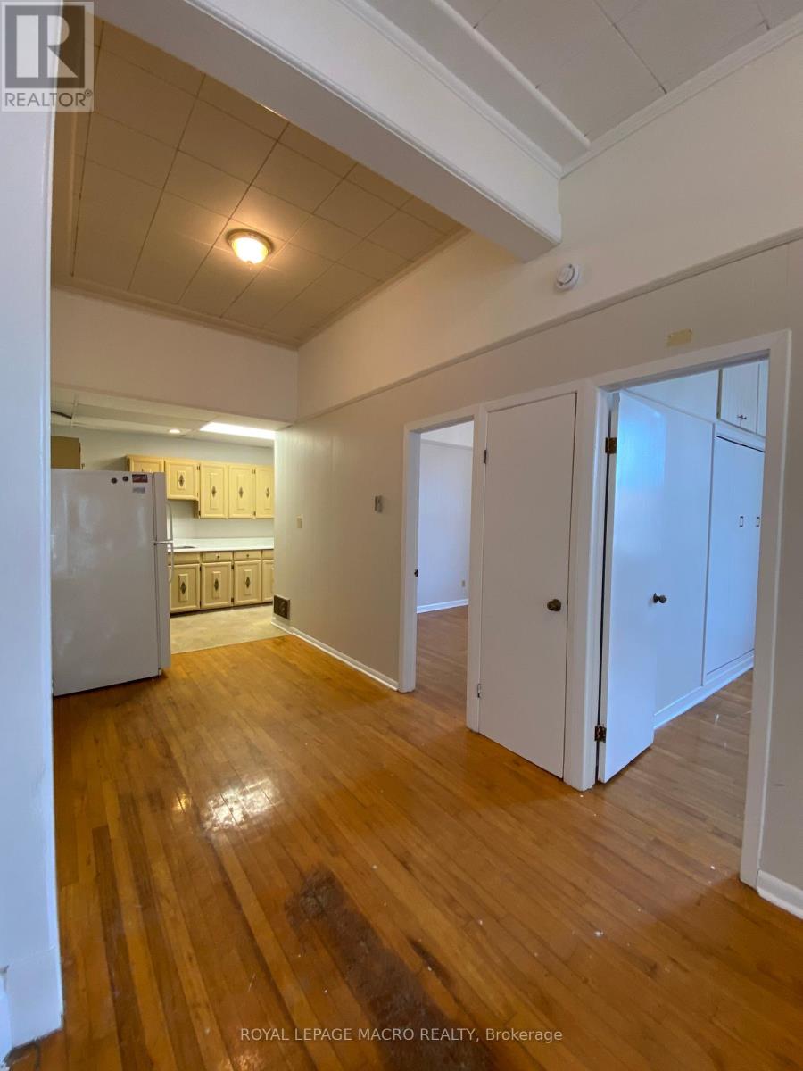 A room with wooden floors and white walls.