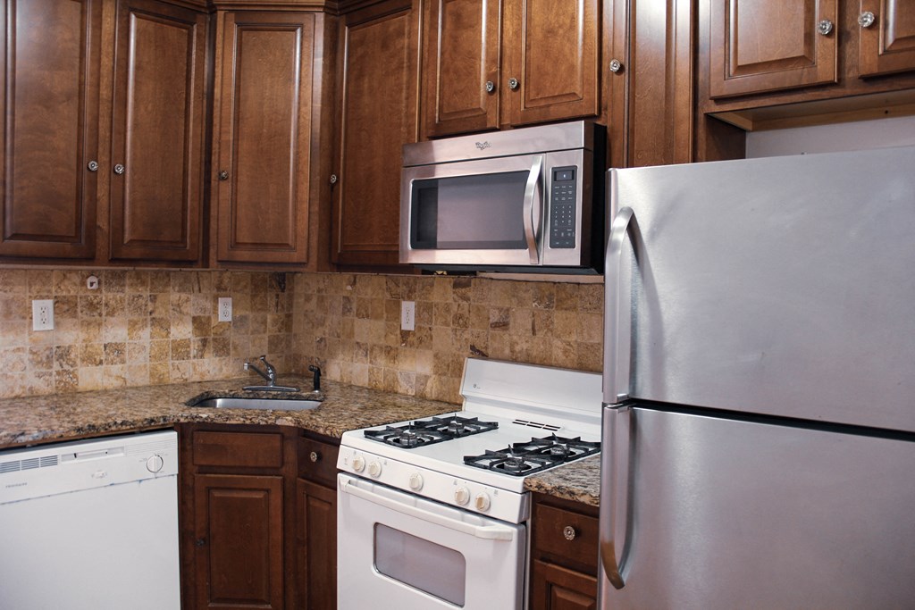 a kitchen with a stove microwave and refrigerator