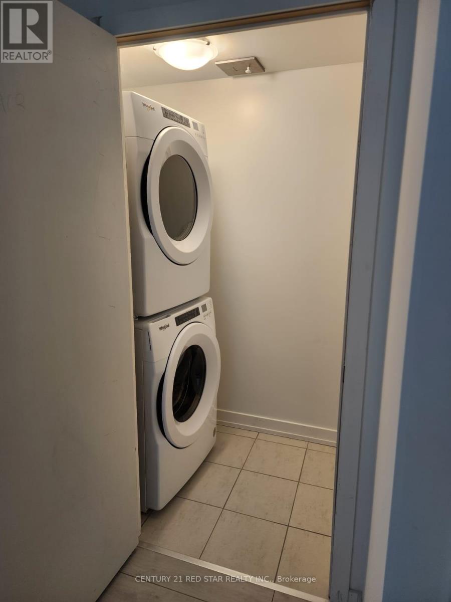 A washer and dryer in a small laundry room.