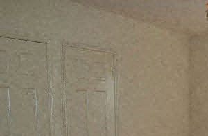 an empty room with a window and a door