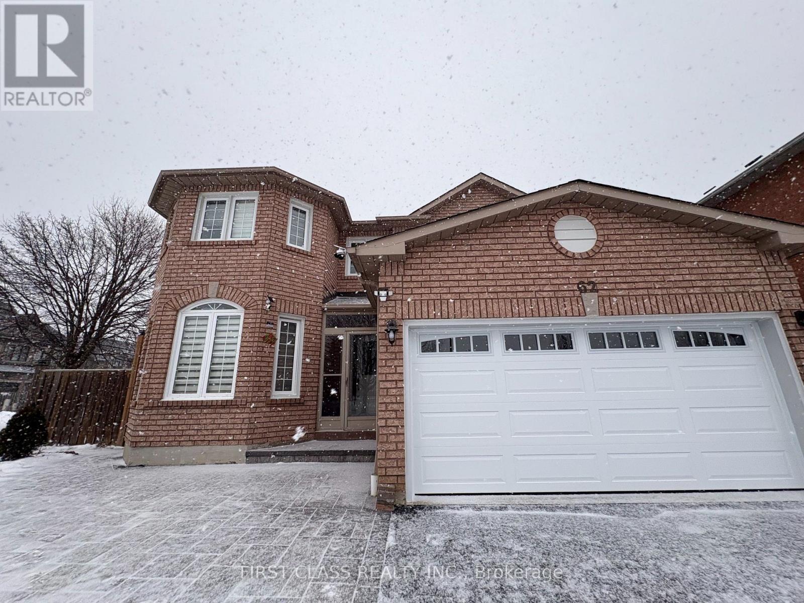 A house with a white garage door is for sale.