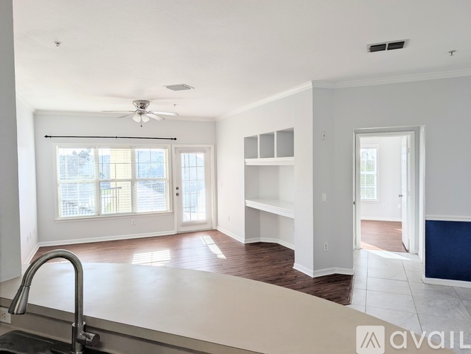 A kitchen with a sink and a window.