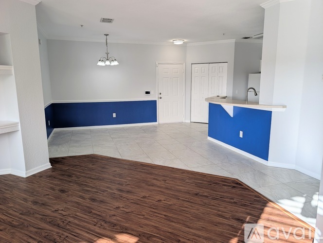 A room with a white ceiling and a blue accent wall.