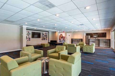 a lobby with couches and chairs and a bar