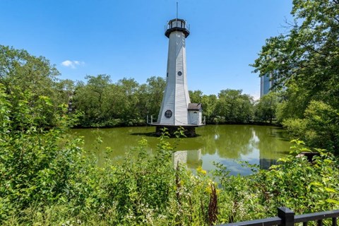 a lighthouse in the middle of a body of water