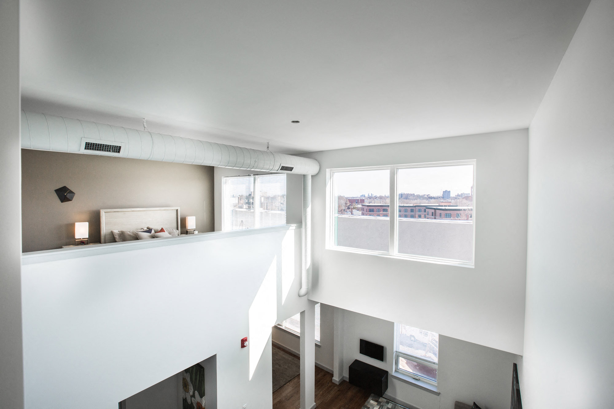 Loft view from top of the stairs overlooking apartment