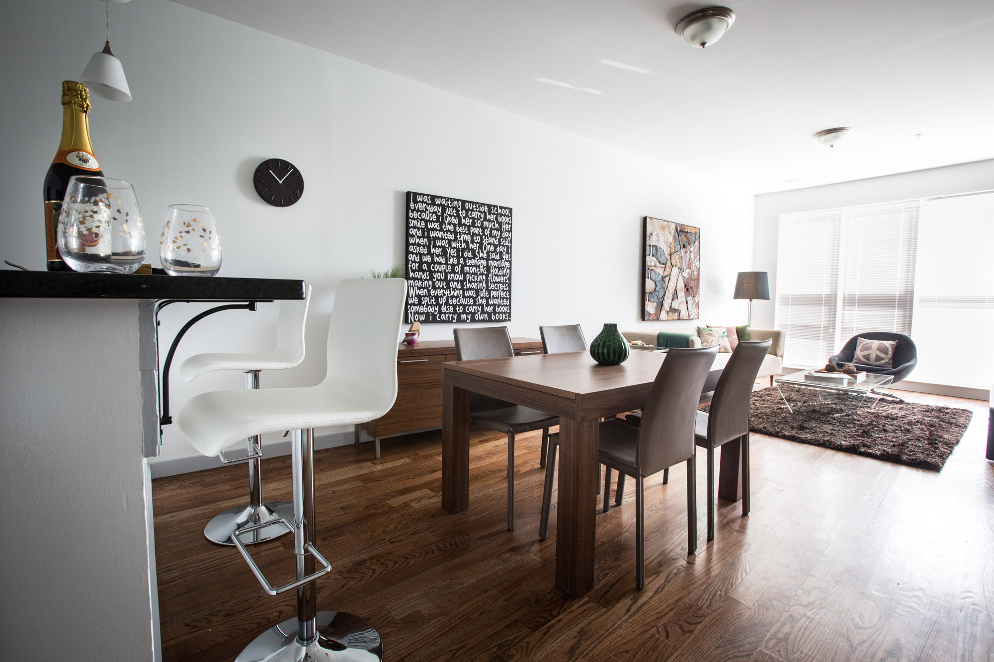 Open layout of breakfast bar, dining room and living room area