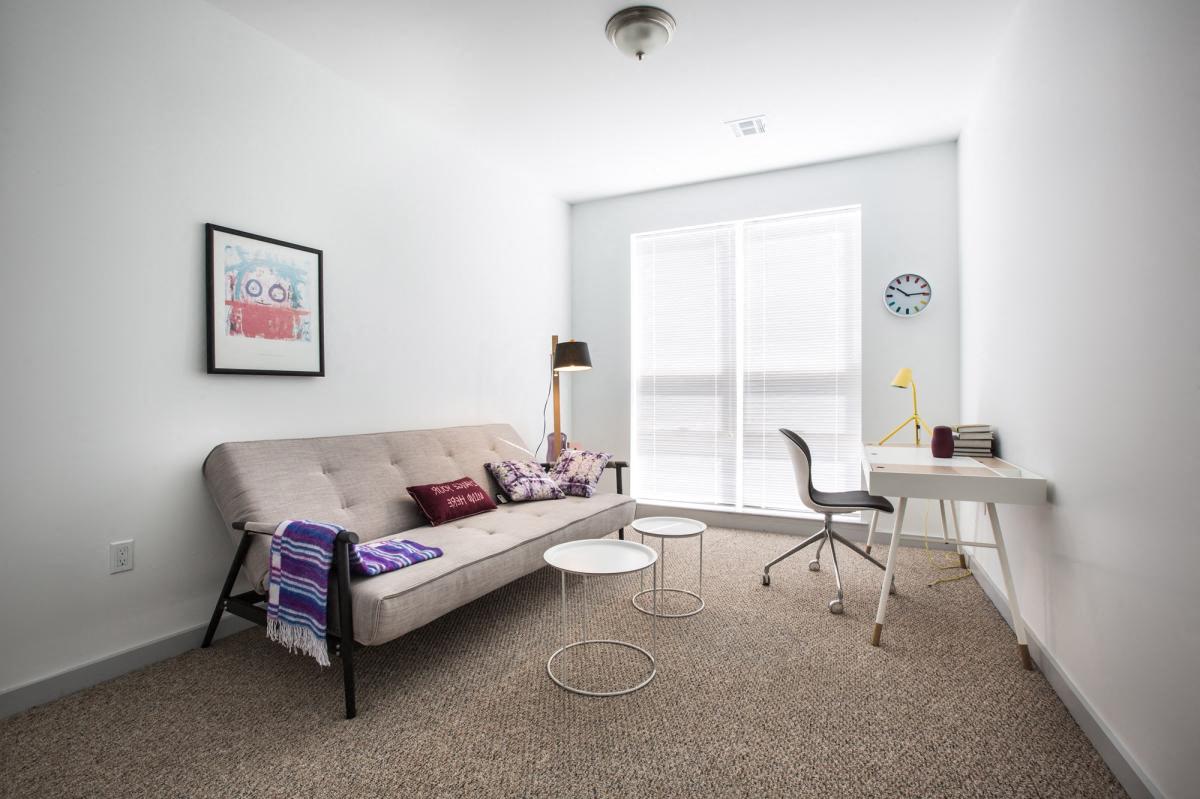 home office with desk, chair and couch