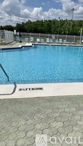 A pool with a sign that says 3 1/2 ft no diving.