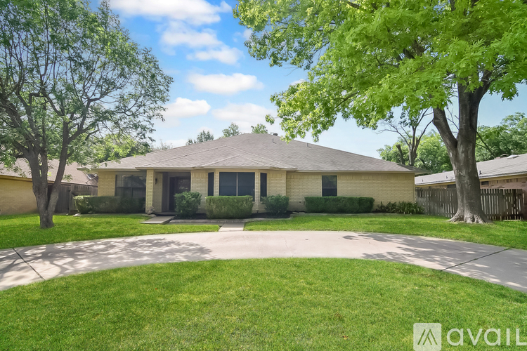 A house with a lawn in front of it.